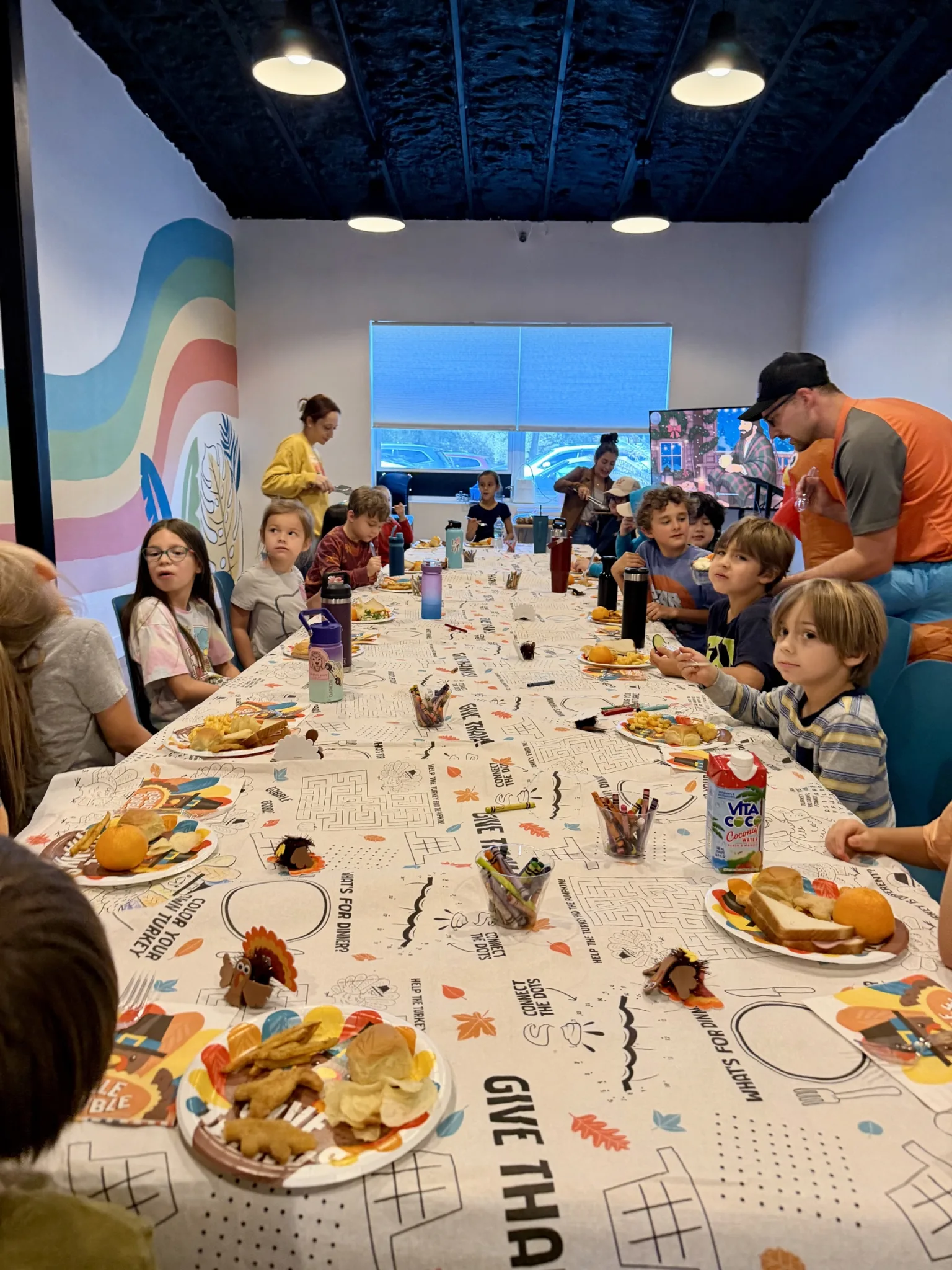 ROC Academy students sharing a table during a community celebration